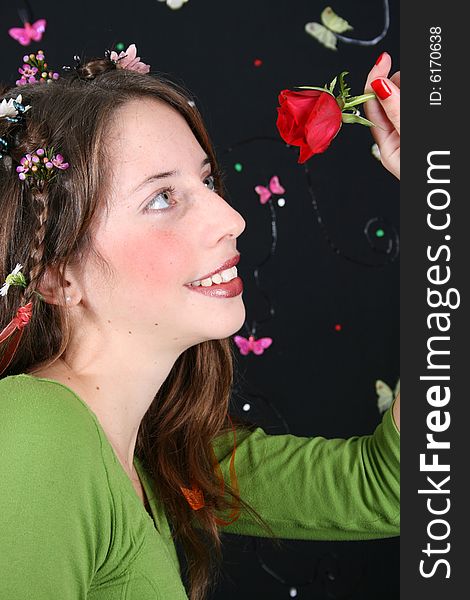 Teenage model with flowers and butterflies in her hair. Teenage model with flowers and butterflies in her hair