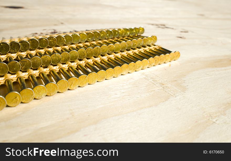 Set of nails for pressured nail gun on a unfinished roof surface. Set of nails for pressured nail gun on a unfinished roof surface.