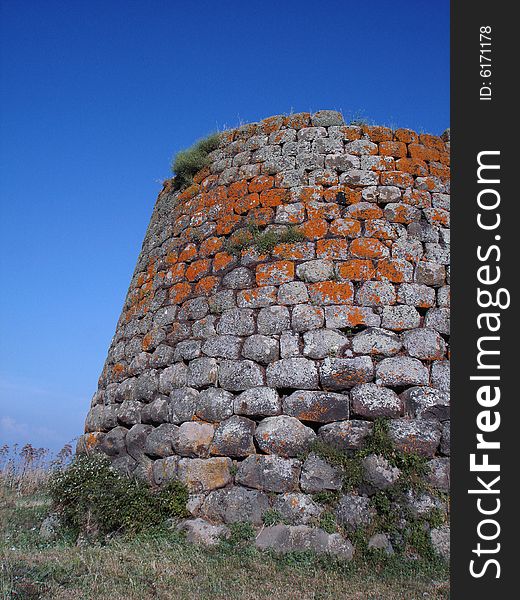 Nuraghe of Santa Sabina in Silanus - Sardinia (Italy). A nuraghe is a typical megalithic sardinian construction of the Bronze Age. Nuraghe of Santa Sabina in Silanus - Sardinia (Italy). A nuraghe is a typical megalithic sardinian construction of the Bronze Age.