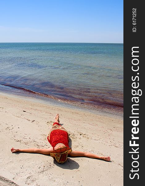 Girl In Dress On Sea Beach