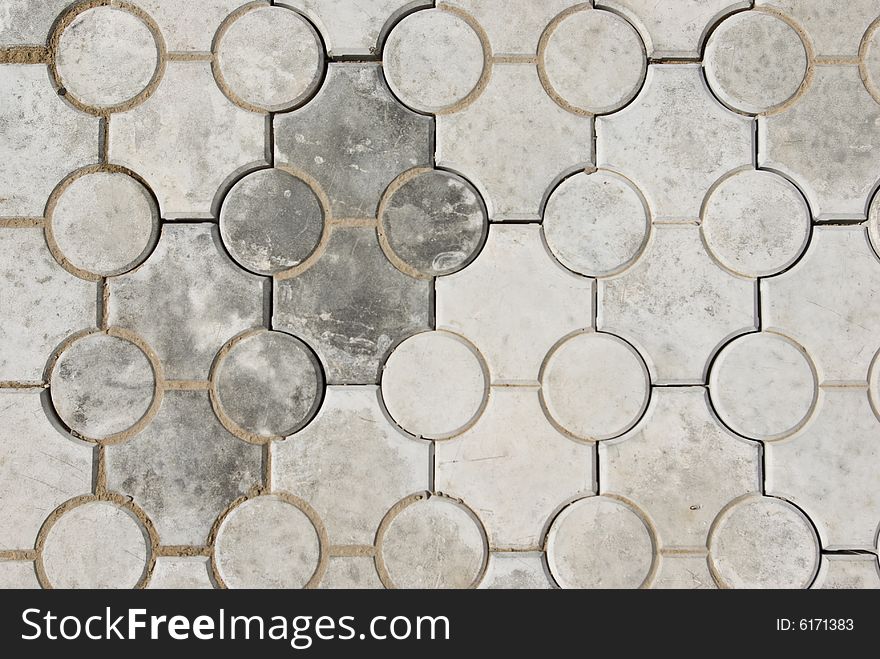 Gray background - tiled concrete floor (two species shape). Gray background - tiled concrete floor (two species shape).