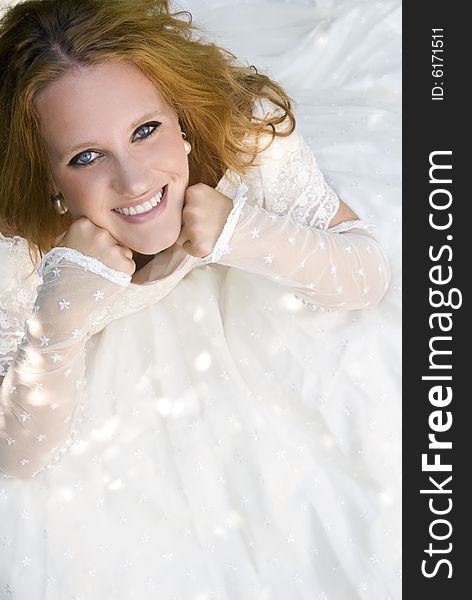 Smiling bride seated down taken from the top