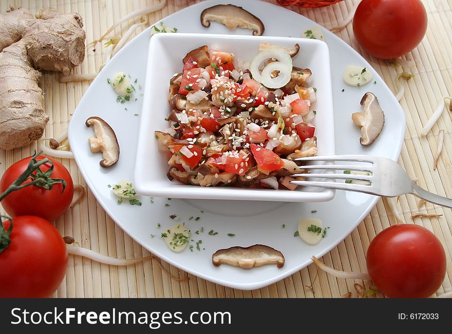 A salad of tomatoes and chinese mushrooms