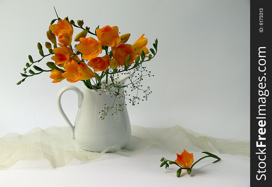 Yellow flowers in white jug. Yellow flowers in white jug