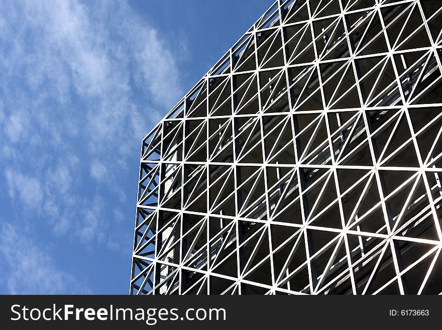 Abstract metallic building and blue sky