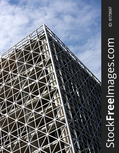 Abstract metallic building and blue sky vertical