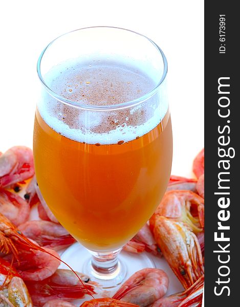 Beer in glass  and  snack - shrimps (prawns) in shells. Beer in glass  and  snack - shrimps (prawns) in shells.