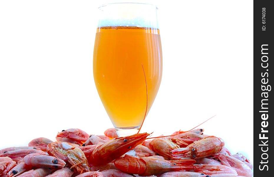 Beer in glass  and  snack - shrimps (prawns) in shells. Beer in glass  and  snack - shrimps (prawns) in shells.