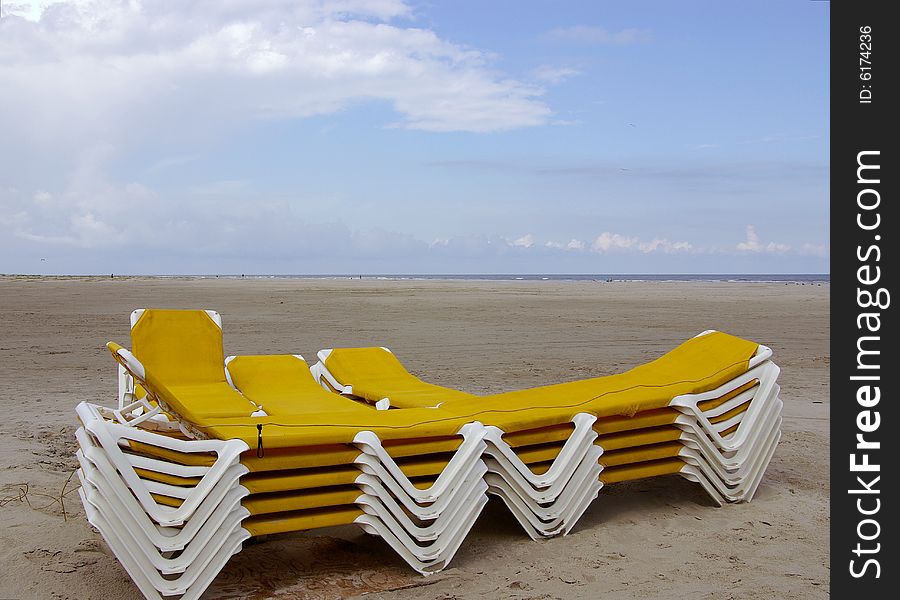 Stocked yellow beach chairs at the beach