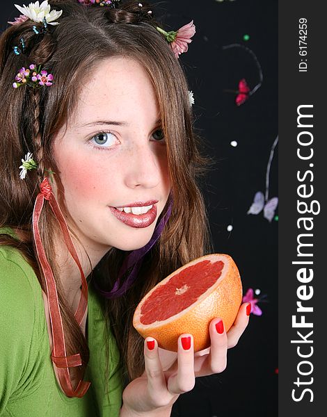 Teenage model with flowers and butterflies in her hair. Teenage model with flowers and butterflies in her hair