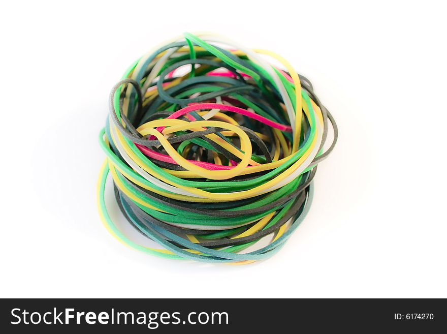 A pile of colored office rubbers on white background