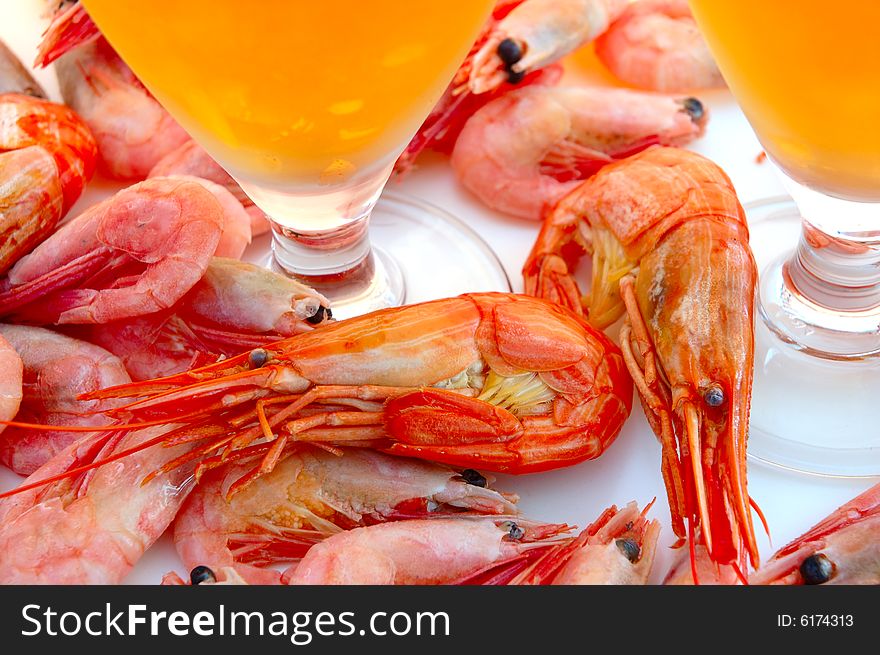 Beer in glass  and  snack - shrimps (prawns) in shells. Beer in glass  and  snack - shrimps (prawns) in shells.