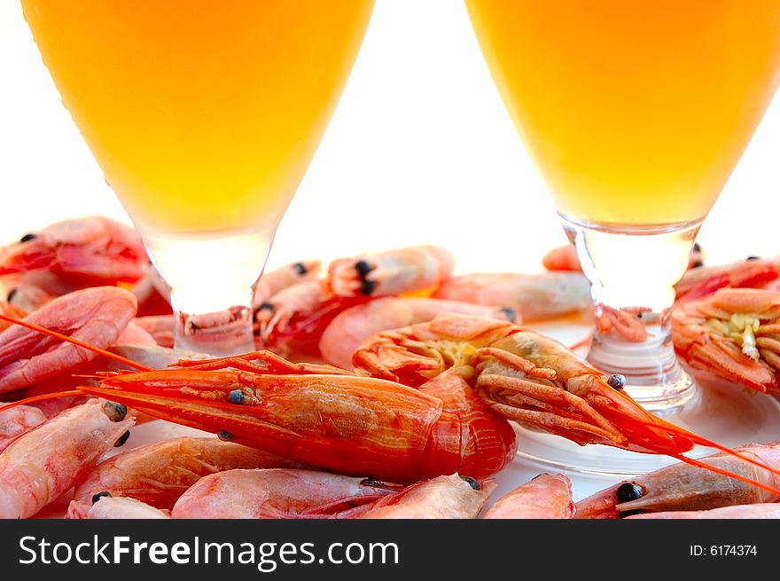 Beer in glass  and  snack - shrimps (prawns) in shells. Beer in glass  and  snack - shrimps (prawns) in shells.