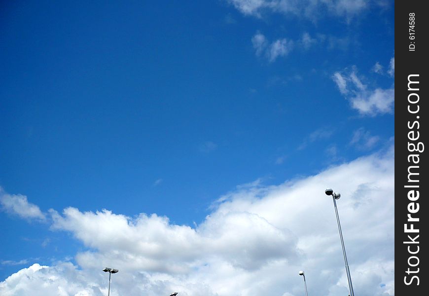 Blue sky with clouds and lamps. Blue sky with clouds and lamps