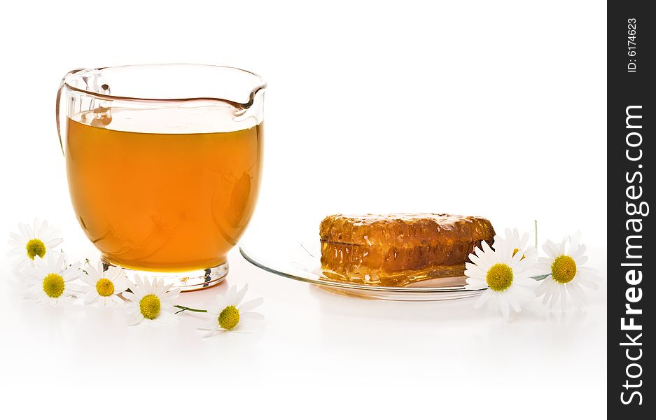 Jar with honey, honeycombs and camomiles. Jar with honey, honeycombs and camomiles