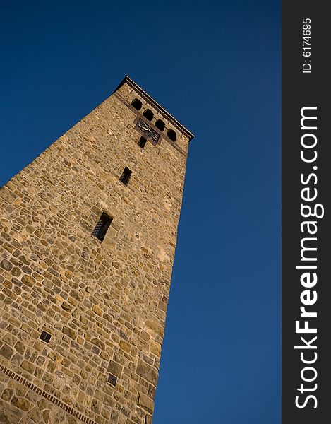 Church tower made of sandstone with a blue sky