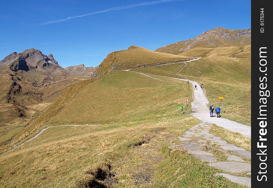 Tourist hiking in swiss alps