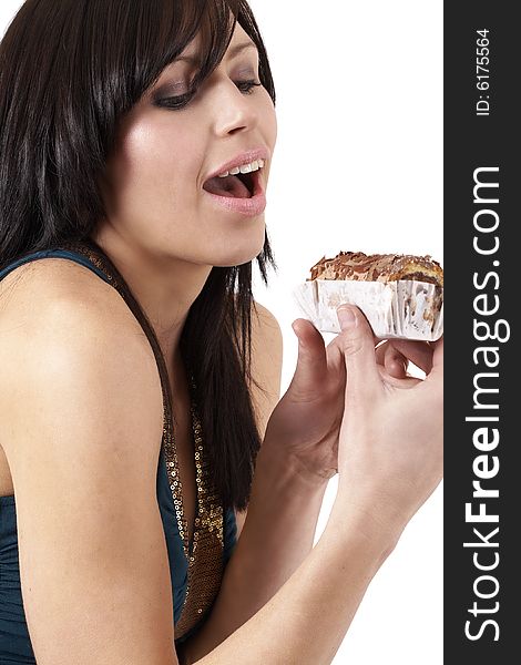 Portrait of a beautiful young brunette woman tempted to eat a chocolate cake. Portrait of a beautiful young brunette woman tempted to eat a chocolate cake
