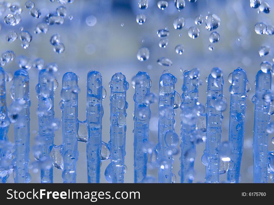 Small water drops on the blue background