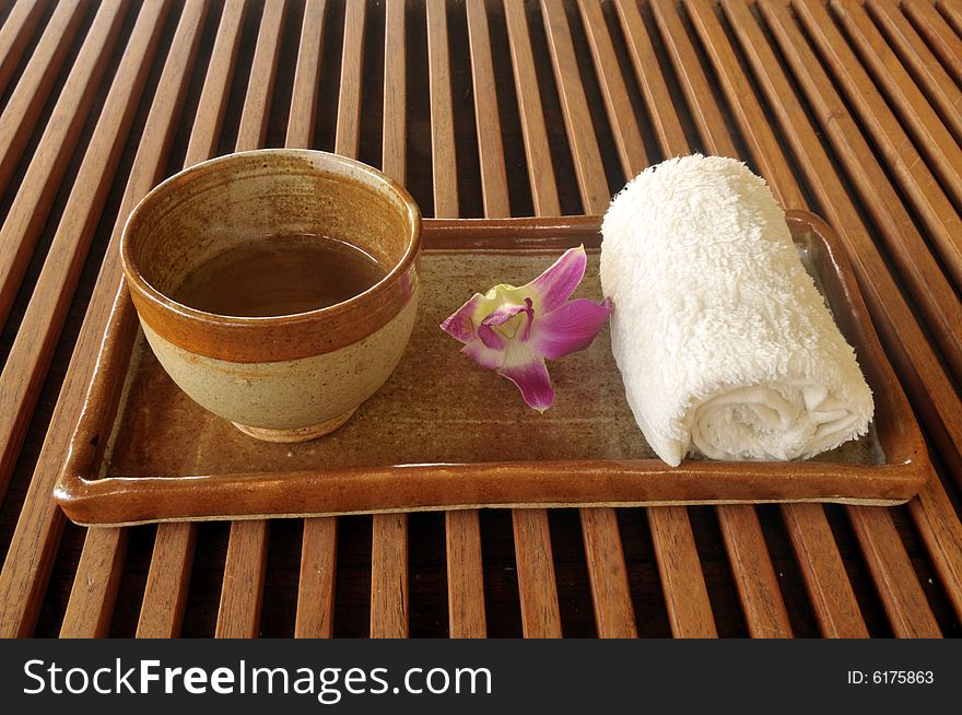 Cup of oriental tea served before massage