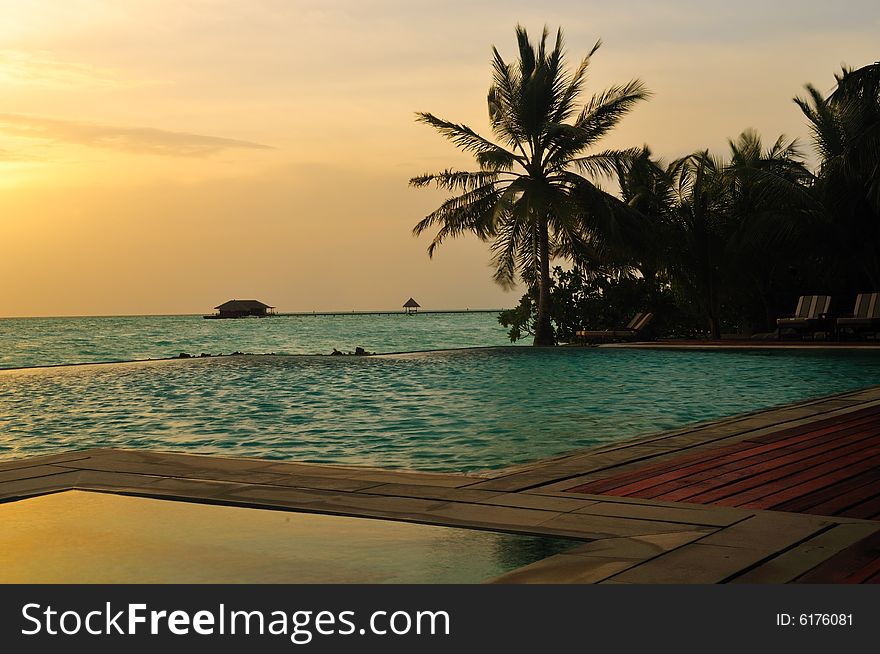 View of sunset on a tropical beach in Maldives