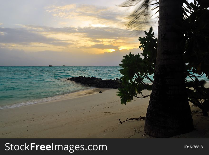 View of sunset on a tropical beach in Maldives