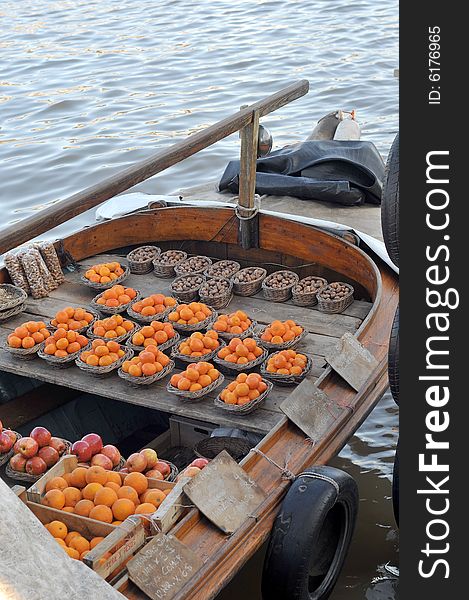 A fruit boat in the late afternoon sun