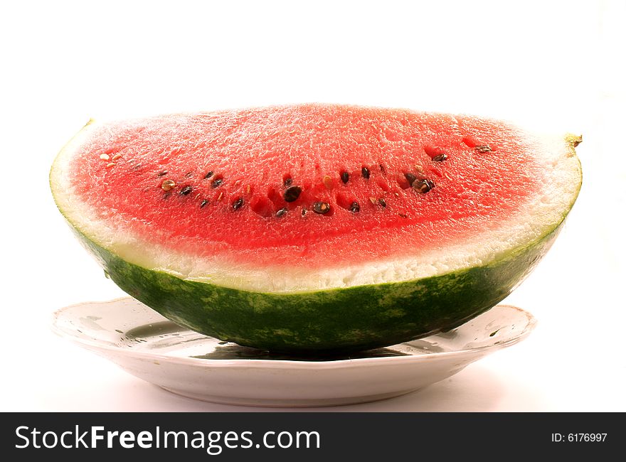 The red and juicy water-melon on the plate