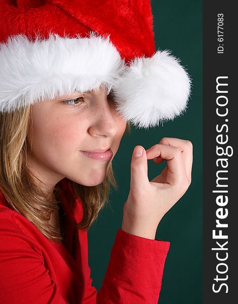 Teenager in red shirt and fluffy christmas hat. Teenager in red shirt and fluffy christmas hat