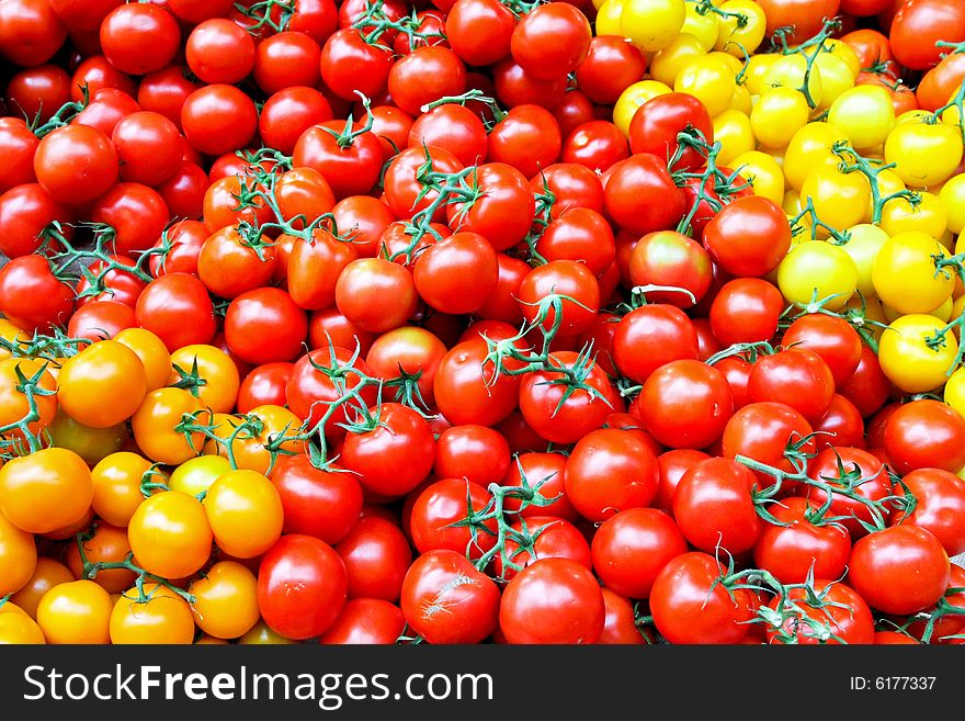 Bunch of small cherry tomatoes on the market