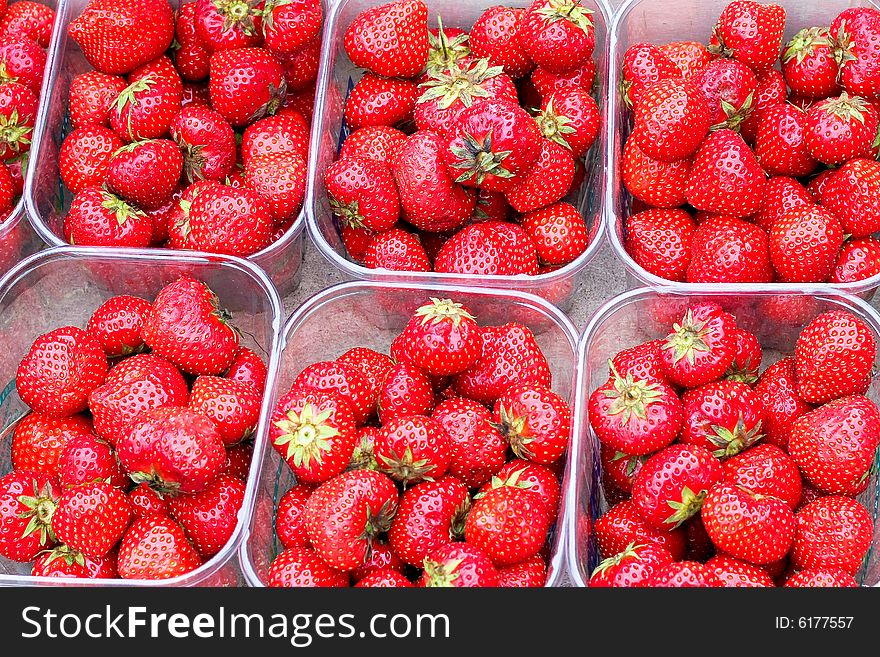 Buckets of fresh organic and natural strawberries