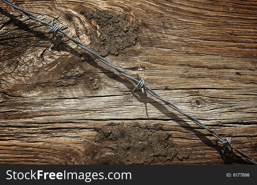 Aged Wood Texture and Barbed Wire Macro Background.