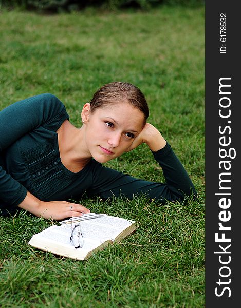 Student Reading in a public park