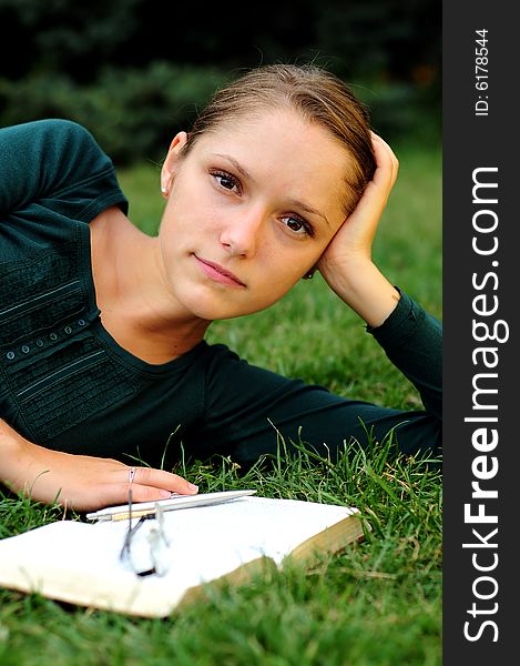 Student Reading in a public park