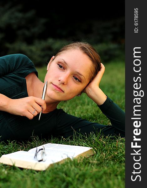 Student Reading in a public park