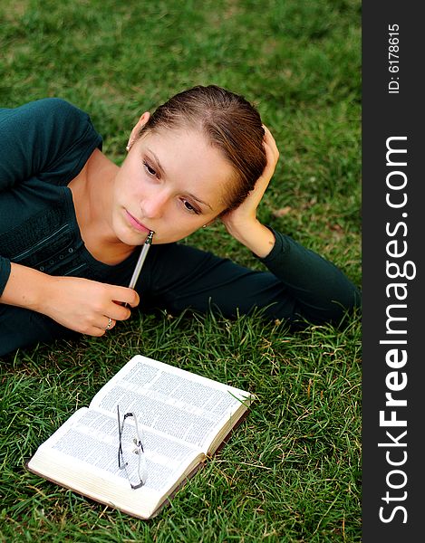 Student Reading in a public park