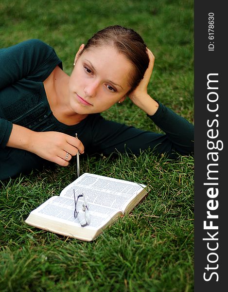 Student Reading in a public park