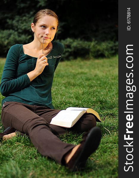 Student Reading in a public park