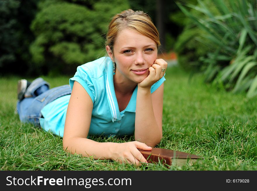 Student Reading in a public park