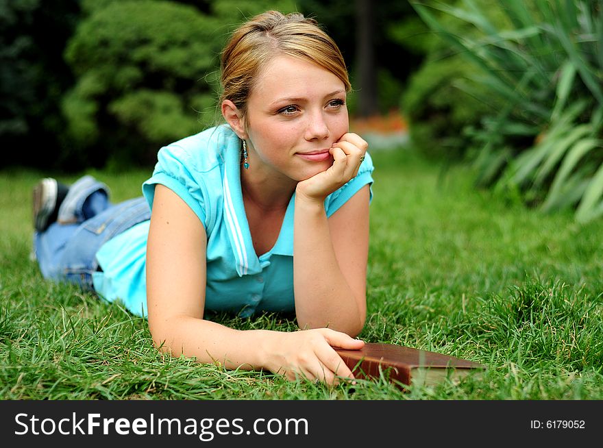 Student Reading in a public park