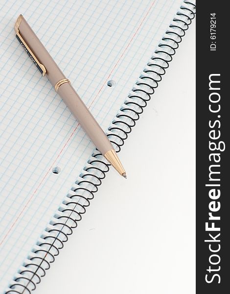 Notebook with pen on white background. Notebook with pen on white background