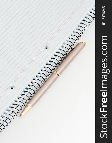 Notebook with pen on white background. Notebook with pen on white background