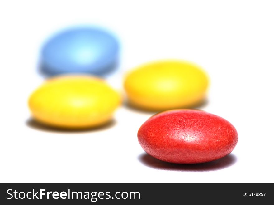 Colorful candies close-up isolated on white