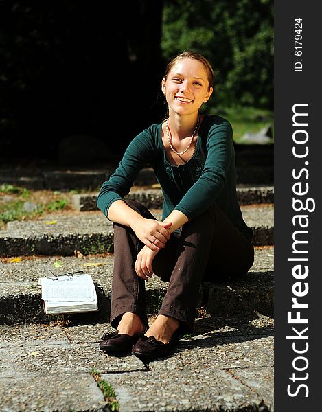 Student Reading in a public park