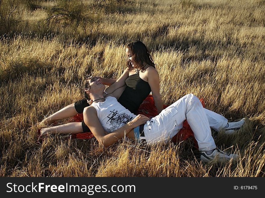 Boy And Girl On The Grass