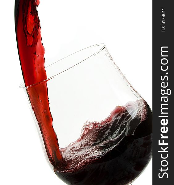 Pouring red wine,isolated on white