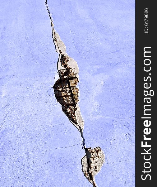 Cracked blue wall of a house in a little village in greece. Cracked blue wall of a house in a little village in greece