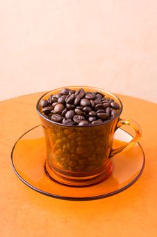 Orange Cup With Coffee Beans Royalty Free Stock Photos Orange Cup With Coffee Beans Royalty Free Stock Photos