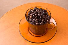 Orange Cup With Coffee Beans Stock Photography Orange Cup With Coffee Beans Stock Photography