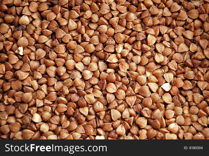 Dried brown buckwheat, texture, background. Dried brown buckwheat, texture, background